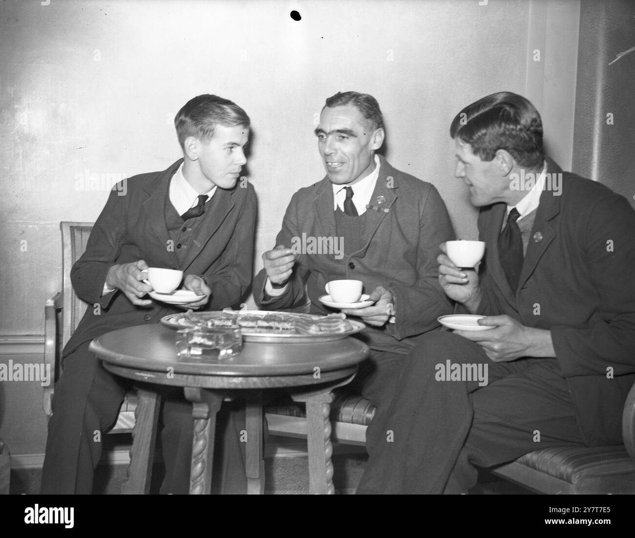 NOT FORGOTTEN” ASSOCIATION ENTERTAINS BRITISH WOUNDED DECEMBER 1944 The Princess Royal was present when the “Not Forgotten” Association entertained British wounded from the Queen Mary Roehampton Hospital at a cabaret tea in the Dorchester Hotel, London, in aid of the Association’s funds. PHOTO SHOWS:- SPHOTO SHOWS:- Pte. Arthur Coldman (left) aged 18, of Putney, South-West London, whose right arm was wounded by shrapnel when he was serving in Holland with the Welch Regiment, talking with Company Sergeant-Major Albert Langley, D.C.M. of the King’s Royal Rifles, who has served 22 of his 44 years Stock Photo