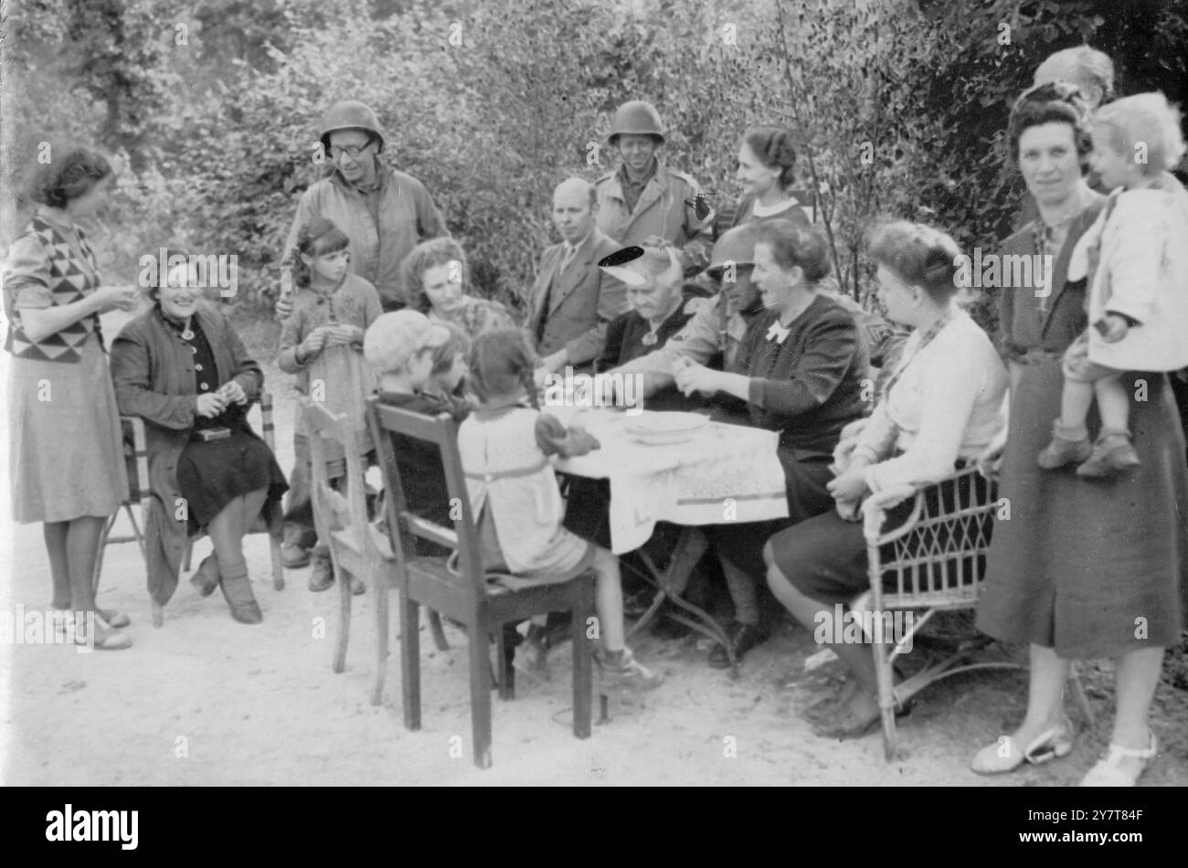 AMERICANS GIVE RATIONS TO GERMANS 1944Photo shows:- In the German town ...