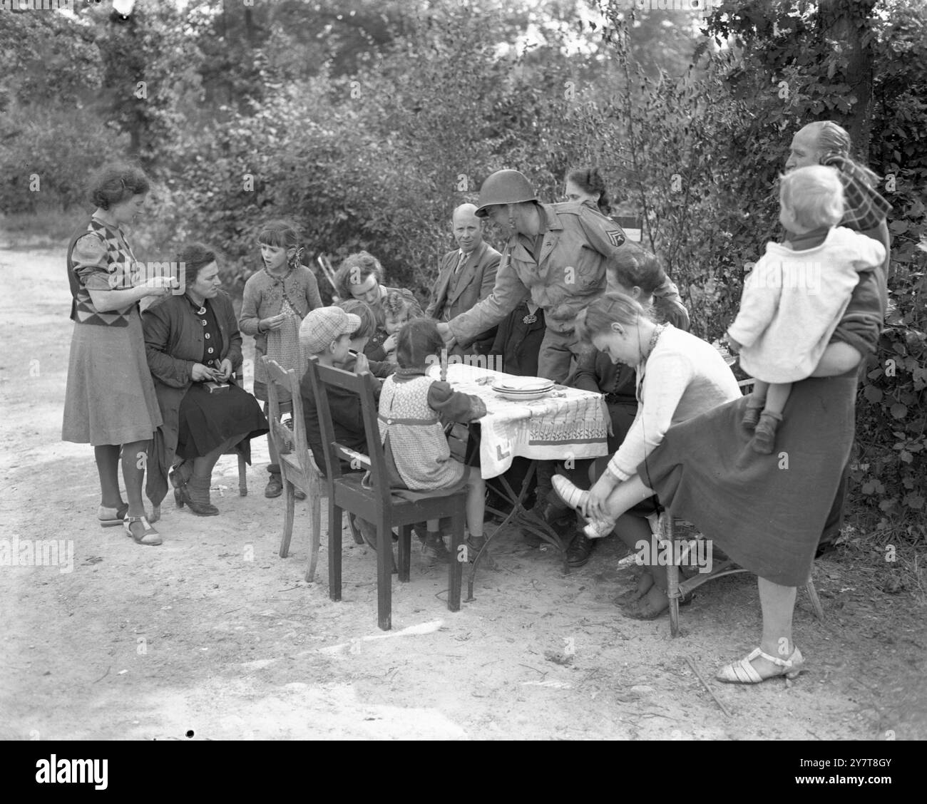 AMERICANS GIVE RATIONS TO GERMANS 1944Photo shows:- In the German town ...