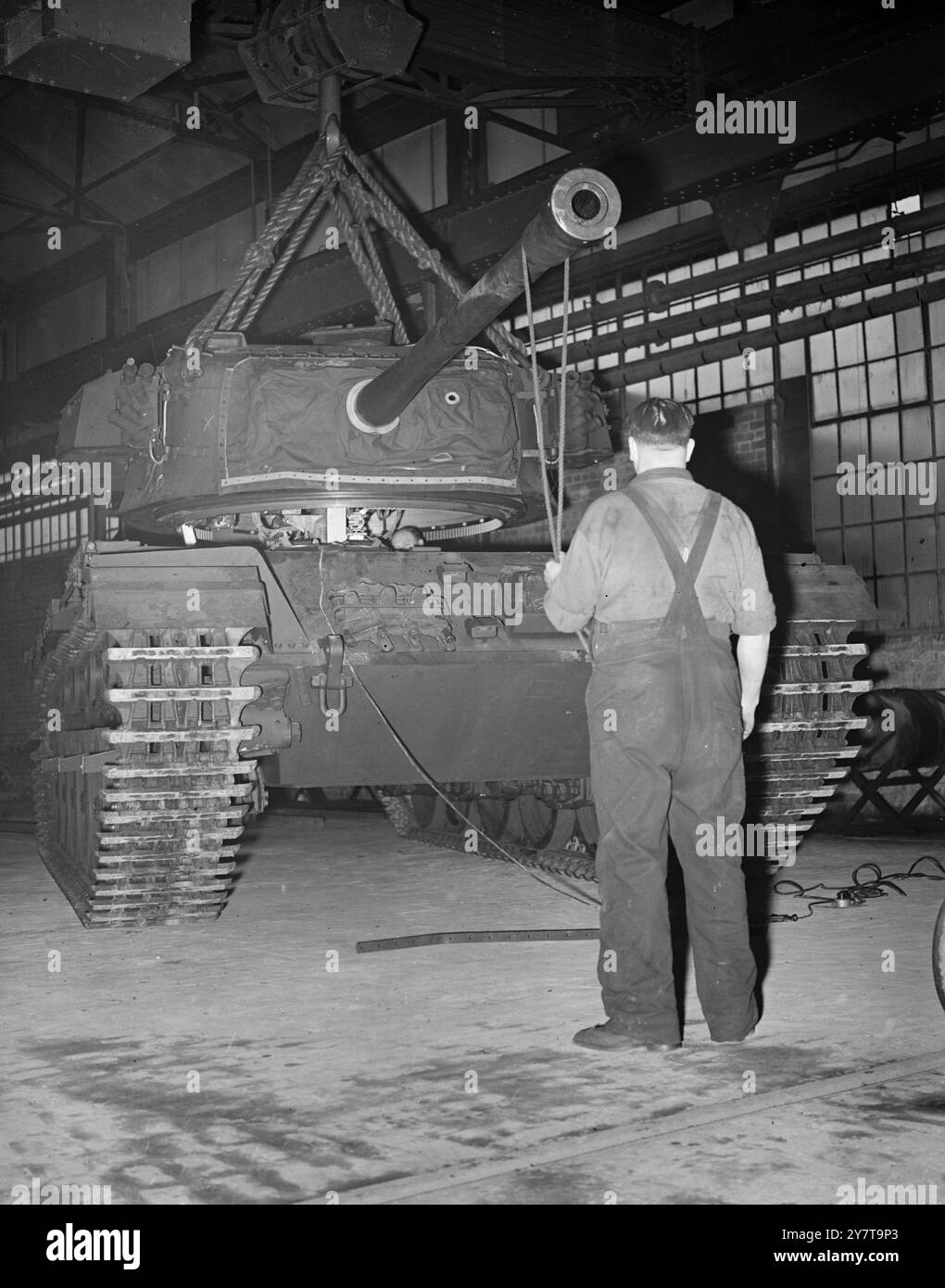 BRITAIN FORGES HER ARMOUR  Turning out Centurions for Britain's legions, now gathering strength in a perilous world situation, is one of the most modern and best-equipped tank arsenals in the world - the Royal Ordnance factory at Barnbow , Leeds, Yorkshire, where these new pictures have just been taken. The 50-ton centurion, Britain's latest fighter vehicle of its kind, is believed to be the only new tank to be produced in quantity by any nation since the end of the war and it is now the standard tank of the Royal Armoured Corps. It is powered by the  ' meteor ' engine, in adaptation of the fa Stock Photo