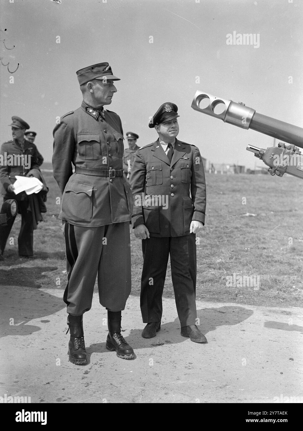 FOREIGN MILITARY OBSERVERS AT BRITISH ARTILLERY DEMONSTRATION 9 May 1950  Foreign military representatives were among the observers at a School of Artillery demonstration at Larkhill, on Salisbury Plain, today (Tuesday). Some of Britain's latest artillery types, including towed and self propelled guns, were shown in a march past and afterwards went into action in a mock engagement with tanks. Helicopters were used for 'spotting'.  Picture Shows: Lieutenant Colonel Clifton Pyle of the American Air Force (right) from Marshal, Texas, and Colonel Divinare R Frey, Commander, 7th Division, Swiss Arm Stock Photo
