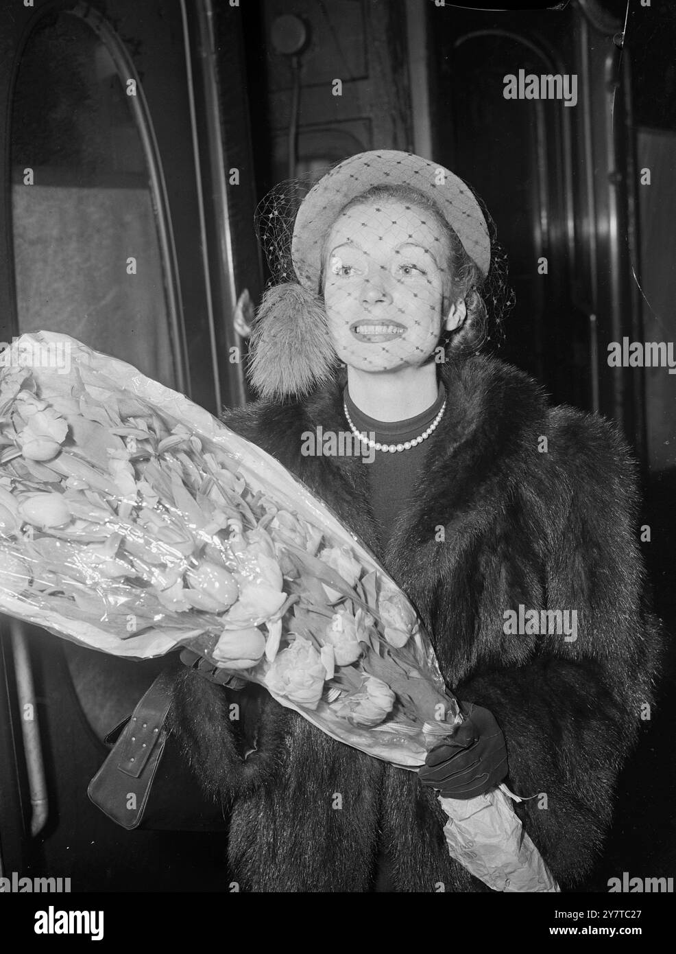 SMILE TO SHOW THE WORLD April 4 1950  Pictured at Victoria Station London this evening (Tuesday) is French actress Gisele Previlie.  She had arrived by the Golden Arrow for the world premiere of her new colour film The Dancing Years, in which she appears as an operetta singer. The film was made partly in the Tyrol and was completed in London last November. Gisele was a mannequin at the age of 15 and was electred Miss France shortly before the war. She is said now to have a bigger British fan mail than French. Stock Photo