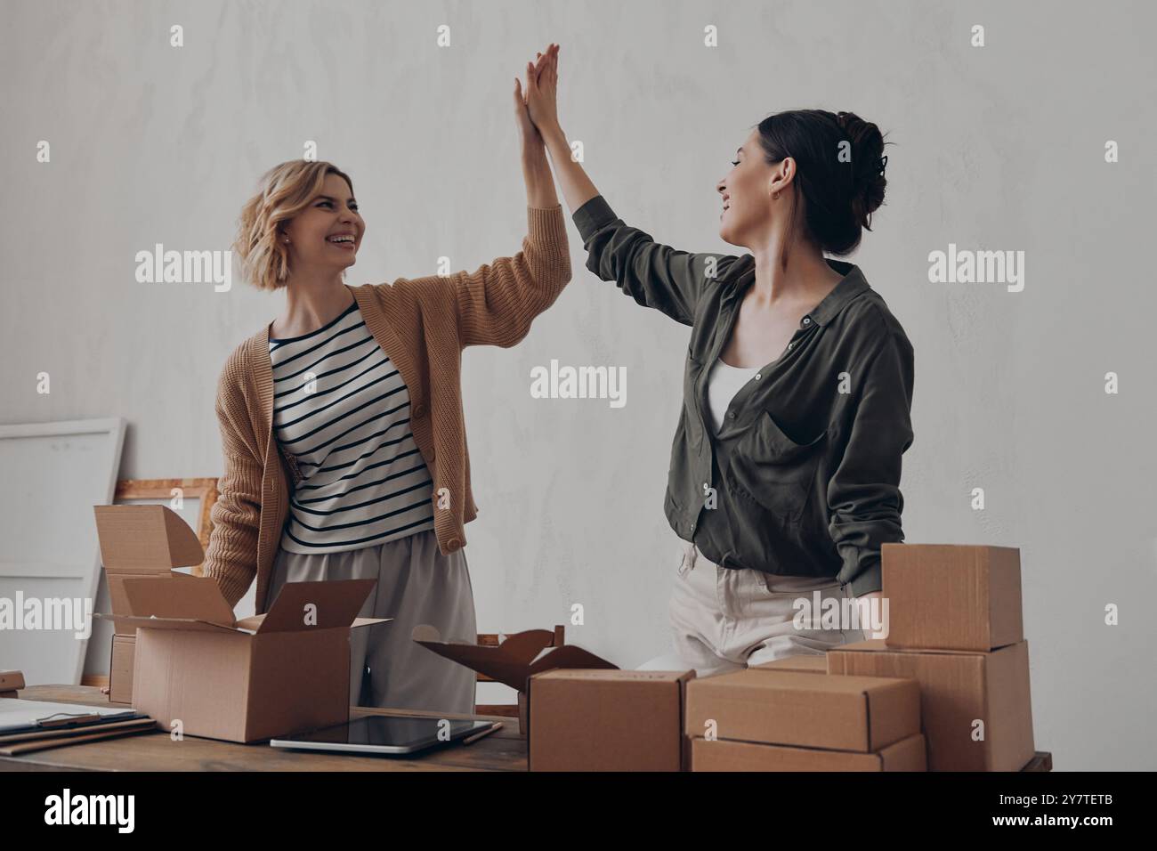 Two young women giving high hi-res stock photography and images - Alamy