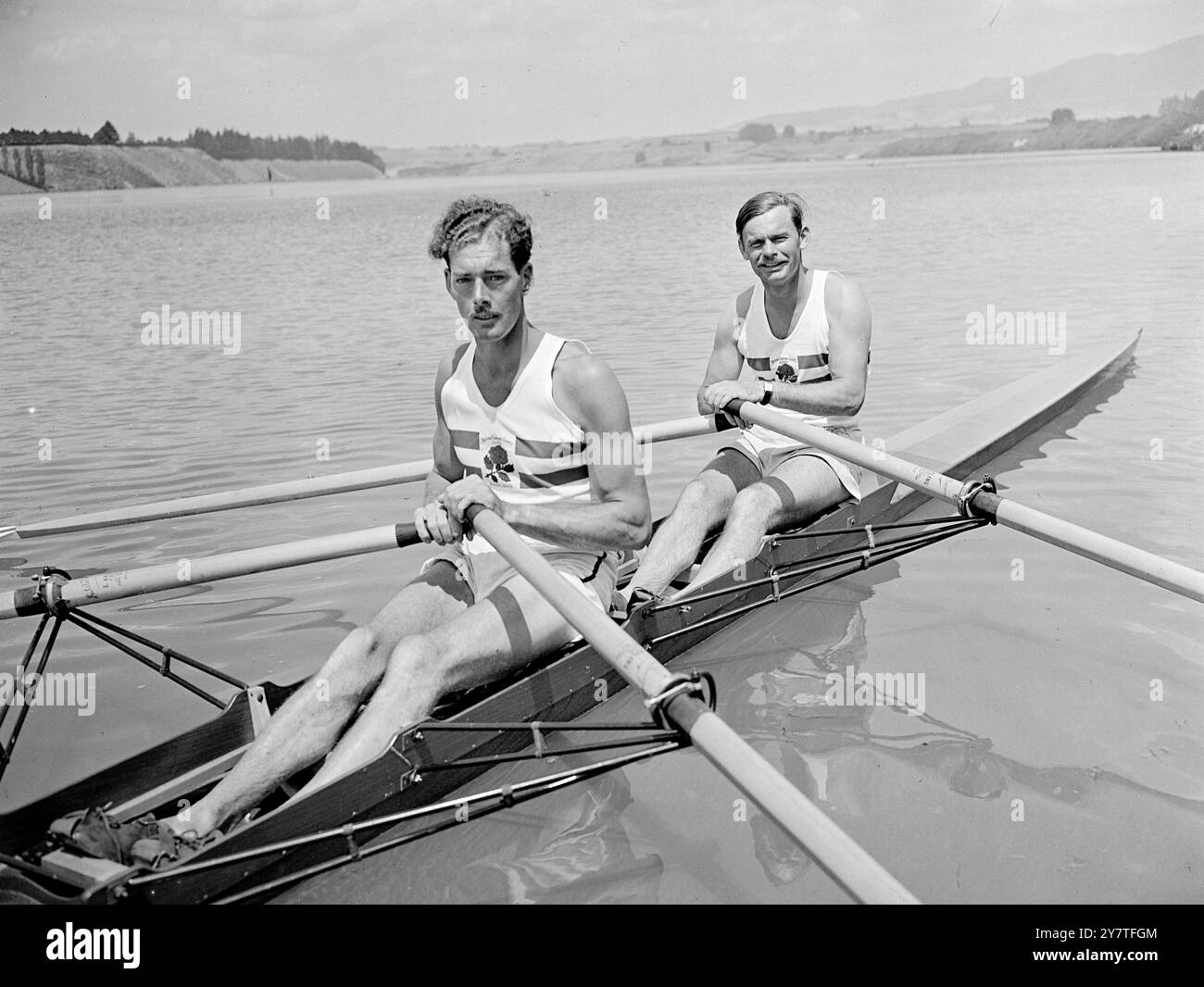 ENGLAND'S DOUBLE SCULLS CHANLLENGER   Jack Brown (left) and Ken Tinegate , England's challengers  in the double sculls event in the Empire games, pictured during training on Lake Karapiro , New Zealand.  They broke 3rd to the Australian and New Zealand pairs. Ken Tinegate , Stoke, who is from Birmingham, was a finalist in the double skulls at Henley last year.  Brown is from Loughborough .    8 February 1950 Stock Photo