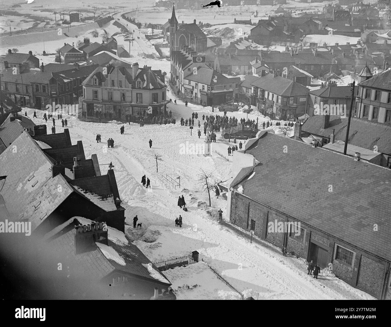 Welsh mining  town - marooned for two days in blizzard - waits for breadHuge snowdrifts have blocked roads and railways all over the country , and there is practicallly no movement on railways in the Welsh valleys.  The coalfields are seriously affected.  Photo shows:  Crowds, including miners who were unable to get to work , waiting in the centre of the town of Brynmawr ( Breconshire) for Army lorries  loaded with bread to relieve the town , which has been cut-off from the outside world for two days , with snowdrifts in many  places twenty feet deep , following the great snowstorms and blizza Stock Photo