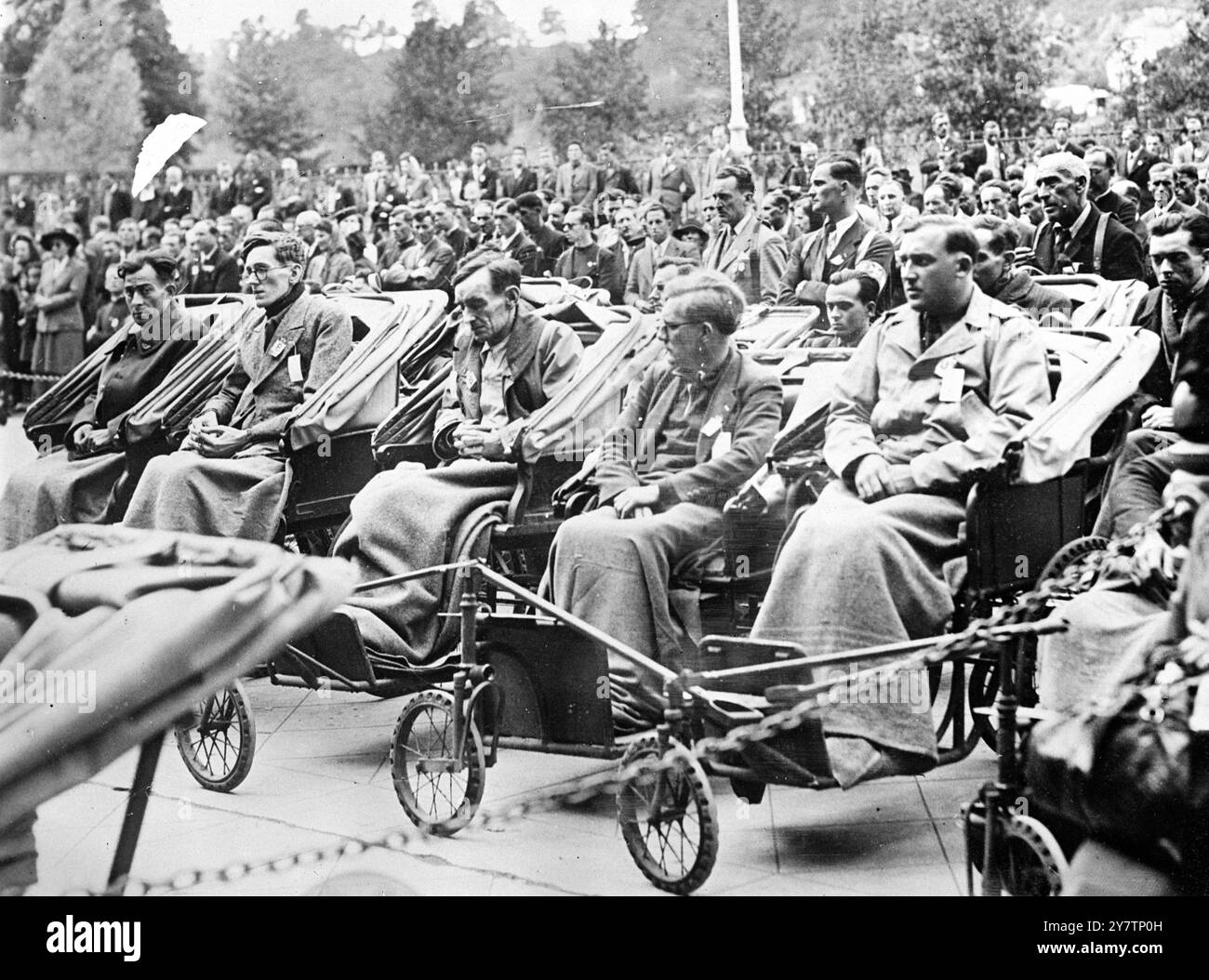 EX WAR PRISONERS PILGRIMAGE TO LOURDES In a great demonstration of faith anf thanksgiving for deliverance, hundreds of former prosoners of war and deportees, many of them disabbled, took part in a pilgrimage to Lourdes, France. Photo Shows: Disabled ex prisoners seated in invalid chairs before the Grotto. 1946 Stock Photo