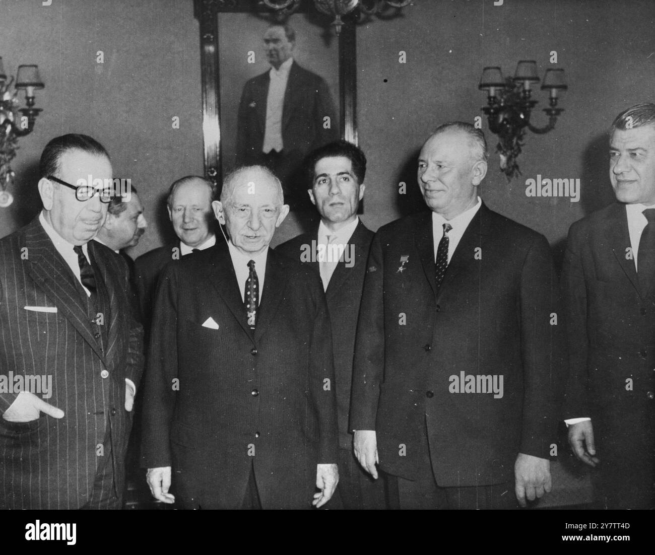 491164 SOVIET-TURKISH TALKS ANKARA, TURKEY :  SOVIET  COMMUNIST PARTY CENTRAL COMMITTEE AND PRESIDIUM MEMBER NICOLAI PODGORNY (SECOND FROM LEFT), PICTURED WITH TURKISH PRIME MINISTER ISMET INONU (CENTRE) AND TURKISH FOREIGN MINISTER FERIDUN CEMAL ERKIN (GLASSES) DURING TALKS IN ANKARA, JANUARY 5TH., ON THE FUTURE OF TURKISH- SOVIET RELATIONS. LATER IN THE DAY, WHEN MR. PODGORNY, WHO IS READING A SOVIET PARLIAMENTARY DELEGATION TO TURKEY - THE FIRST IN THIRTY YEARS — VISITED THE TURKISH NATIONAL ASSEMBLY, THERE WERE ANGRY SCENES OF PROTEST OVER AN ADDRESS GIVEN BY MR .PODGORNY WHICH SOME DEPUTI Stock Photo