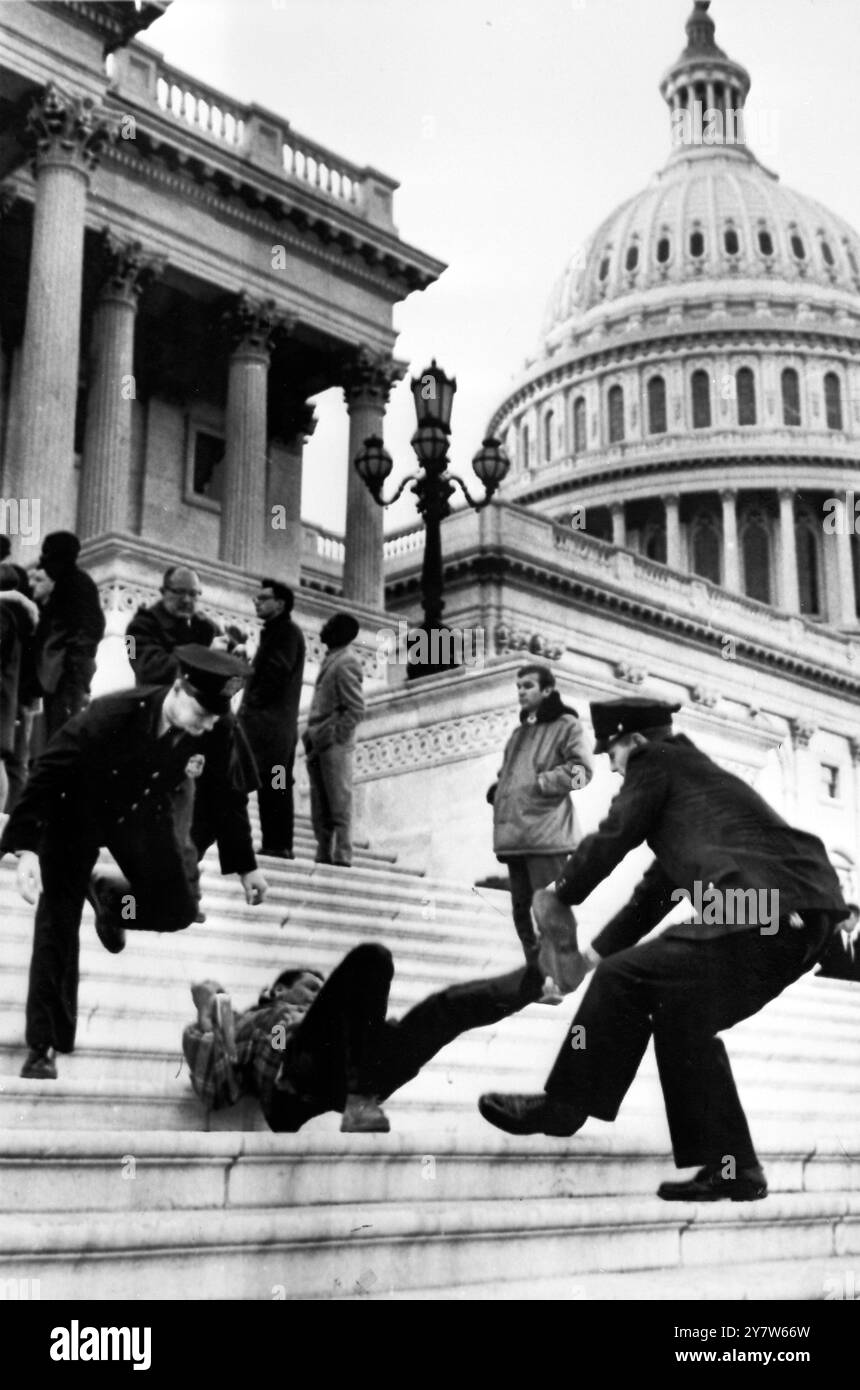ORIGINAL CAPTION - Washington DC, USA : Police are pictured dragging a ...