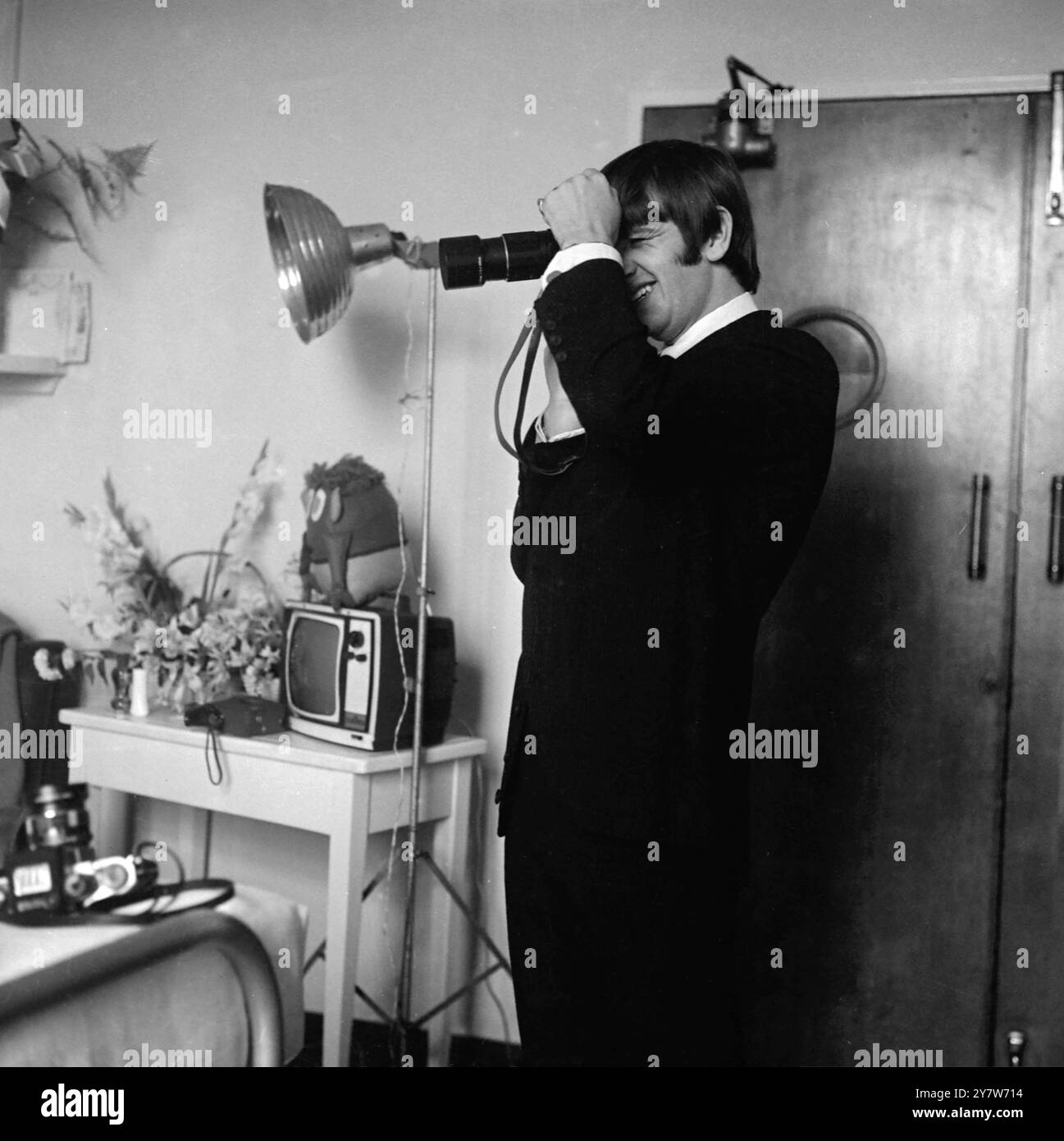 RINGO SHOOTS ZAK.... London: Happy Father, Beatle drummer Ringo Starr is pictured with a camera taking his own pictures of his baby son Zak, born to 19 year old wife Maureen at Queen charlottes Hospital, London, 4 September. The baby was named Zak because of its parents fondness of western stories. 22 September 1965  22 September 1965 Stock Photo