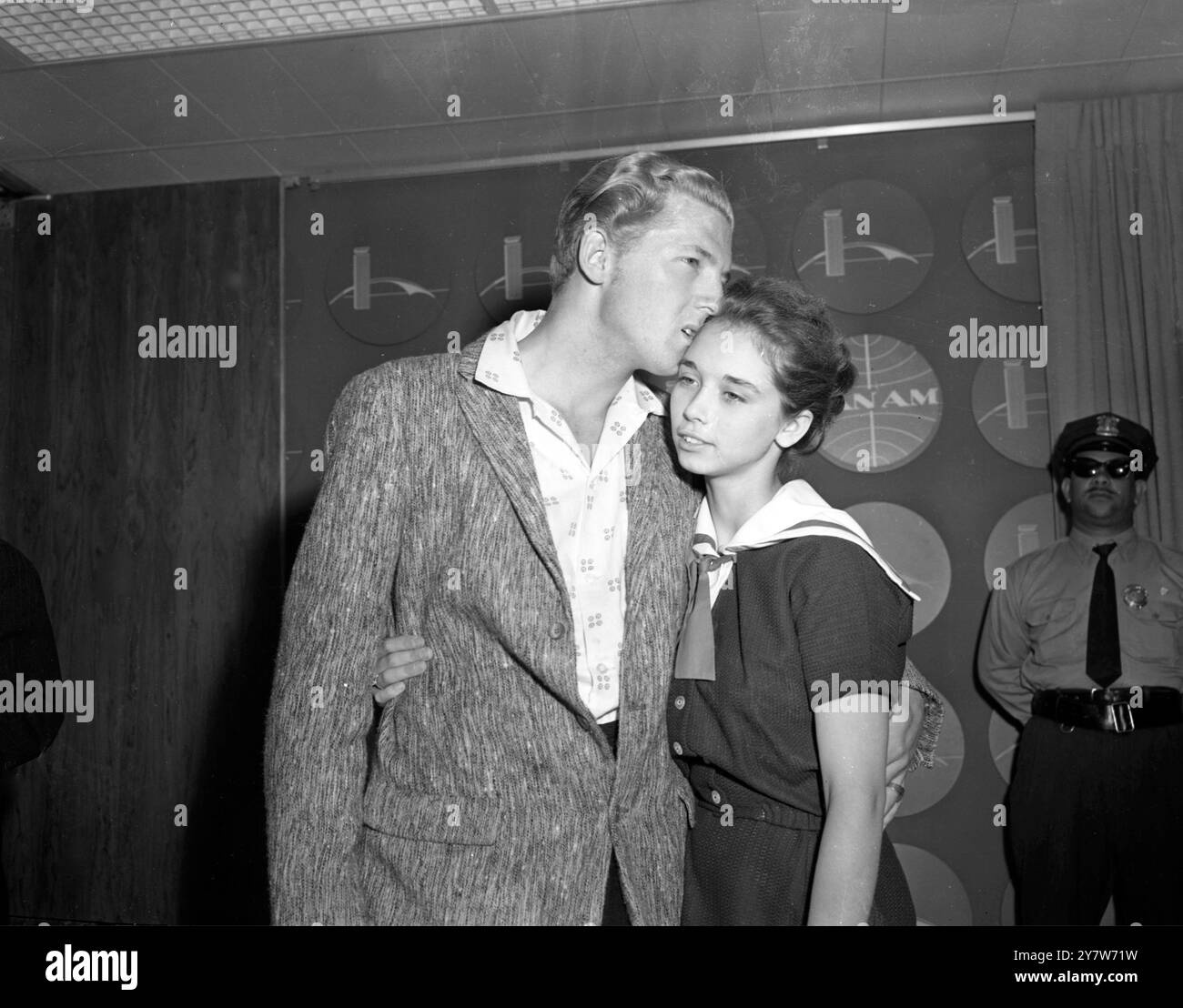 Rock and Roll singer Jerry Lee Lewis arrives at New York's airport today with his 13 year old bride, Myra back from Britain, following the cancellation of his  six weeks tour of this country. 22 year old Lewis, whose matrimonial affairs raised quite a rumpus in this country so that his tour had to be cancelled, left London with his wife's mother and father.28 May 1958 Stock Photo