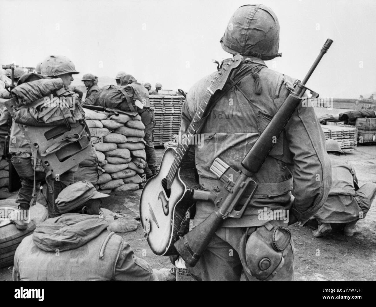 Man for all seasonsA US marine with an M-16 rifle over one shoulder and ...
