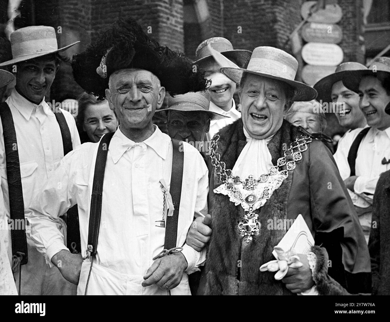 Alkmaar , Holland : When he visited the famous cheese market in Alkmaar , near Amsterdam , the Lord Mayor of Birmingham couldn't resist the temptation of swapping hats with one of the cheesemakers , who wore a traditional straw sombrero style trilby! And the cheese-maker found it quite a good exchange - he enjoyed wearing the Lord Mayor's hat! The Lord Mayor was visiting the town for the opening of the ' British Week ' which will be held in seven different towns in Holland. - 22 May 1955 Stock Photo