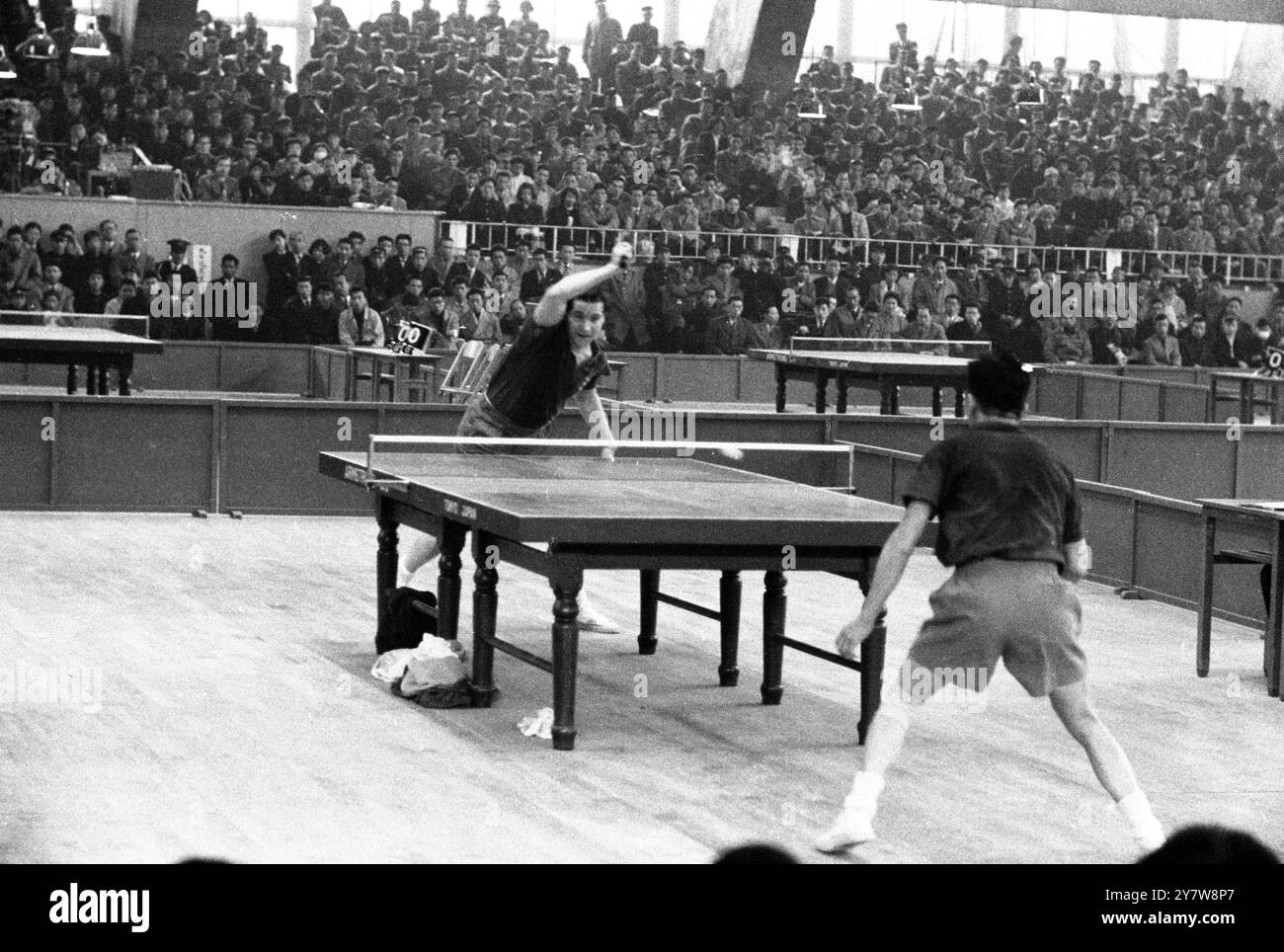 A Victory for Britain's BergmannTokyo , Japan :  Table tennis star , England's Richard Bergmann sends over a forehand drive to Chiang Yuang-Ning (back to camera ) of China , during play for the Swaythling Cup at the 23rd World Table tennis championships , held in Tokyo .  Bergmann won by two sets to one. 6 April 1956 Stock Photo