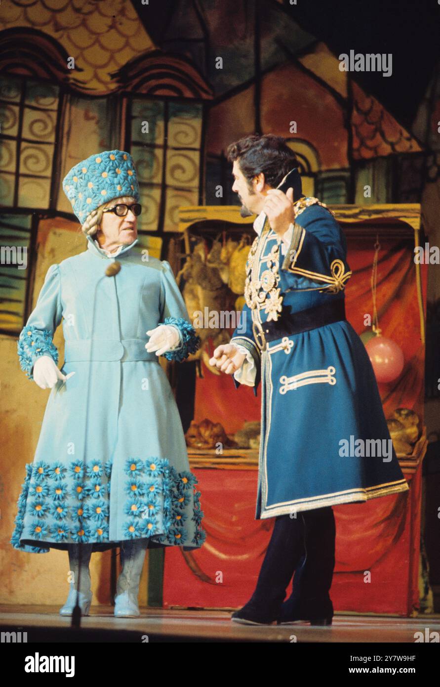 Arthur Askey on the left in a Christmas Pantomime playing the dame ...