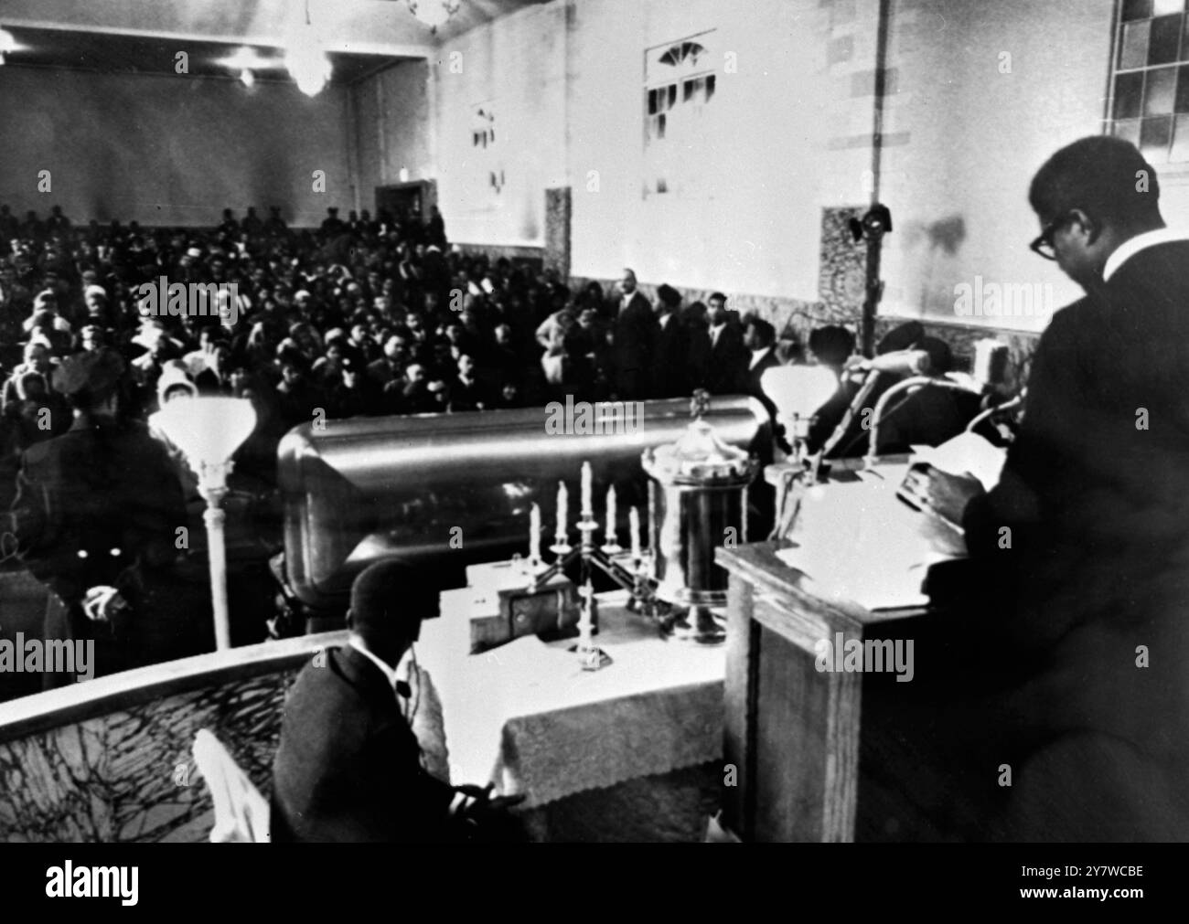 Impressive funeral service for Malcolm X - New York : actor Ossie Davis speaks to a crowd of some 1,000 attending the funeral service for slain nationalist leader Malcom X in the Faith Temple here today . Davis praised Malcolm X as a ' man who could unite many diverse elements . ' Messages from black and civil rights leaders from around the nation were read during the services . - 27 February 1965 Stock Photo