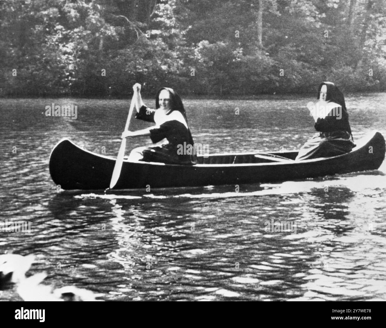 Lady rowing a boat Black and White Stock Photos & Images - Alamy