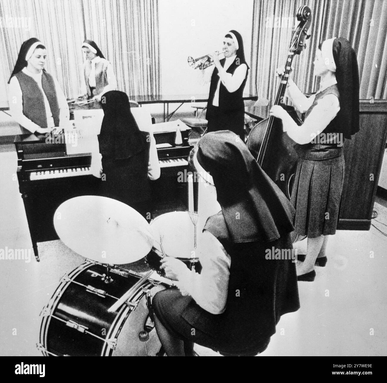 The uniforms are unusual for jazz musicians ... but these six nuns play solid jaz .  They are all from the Kansas City area and play at clubs or for oganisations .  On 16th May they played for Leavenworth Prison inmates .  The six shown rehearsing recently are Sister Mary Vicentia , bass , Sister Rita McGrath , drums , Sister Madeleva , blowing trumpet , Sister Dominic on the piano , Sister David Marie , marimba and Sister Mary Roselle who is their singer . 24 May 1969 Stock Photo