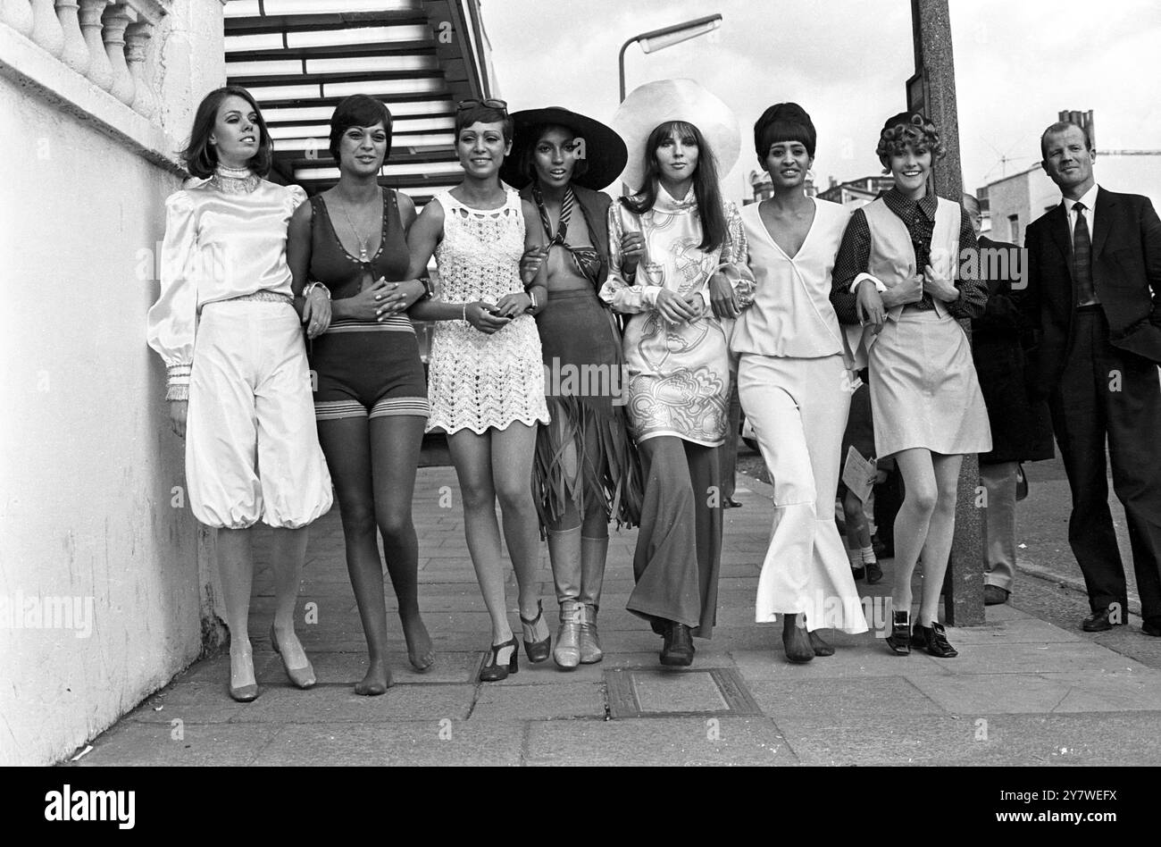 Models parade in swinging King's Road , Chelsea , London , England , in soome of the outfits they will wear at fashion shows staged at the Pheasantry Club . The clothes are the work of top Chelsea designers who staged what they called  a Chelsea Fashion Festival in the discotheque and restaurant of the club as proof that Chelsea Fashion was no longer just a gimmick , but the very heart of British Fashion . 7 June 1968 Stock Photo