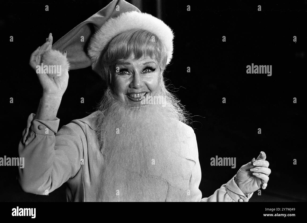 Ginger Rogers , American star of the musical ' Mame ' is seen in a Father Christmas guise , as she dons whiskers , beard and hat , at a preview at the Theatre Royal in London  18 February 1969 Stock Photo