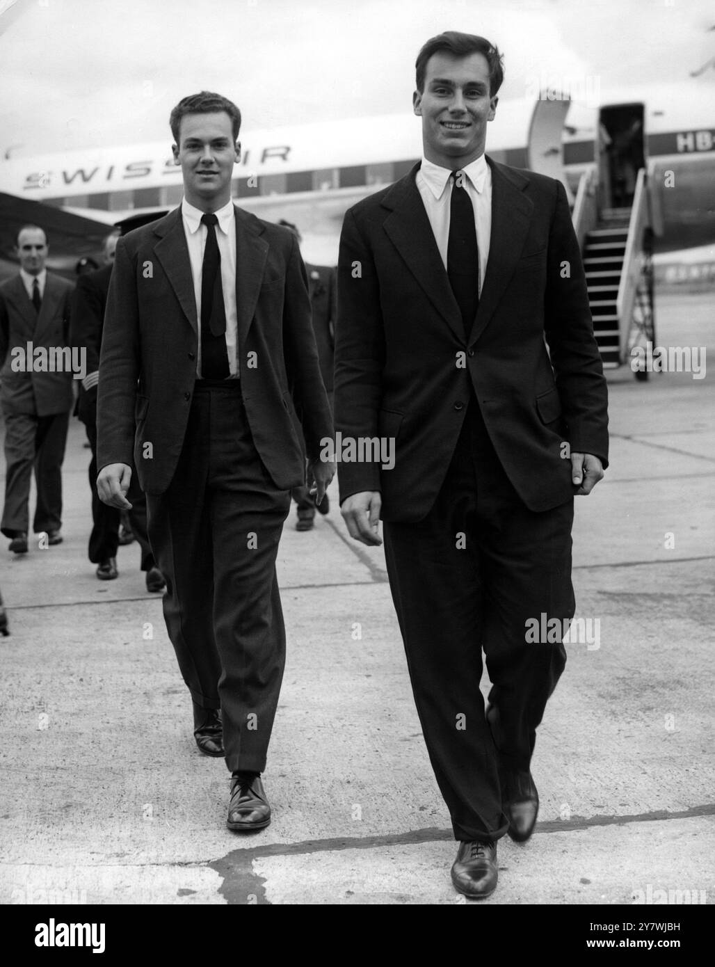 Shah Karim al-Hussayni : Born 13 December 1936 Prince Karim Aga Khan , seen here as Aga Khan IV with his brother  Prince Amyn (left) , who met him on his arrival at London Airport , England from Geneva . The Aga Khan is visiting his mother , Princess Joan Aly Khan  26 July 1957 Stock Photo
