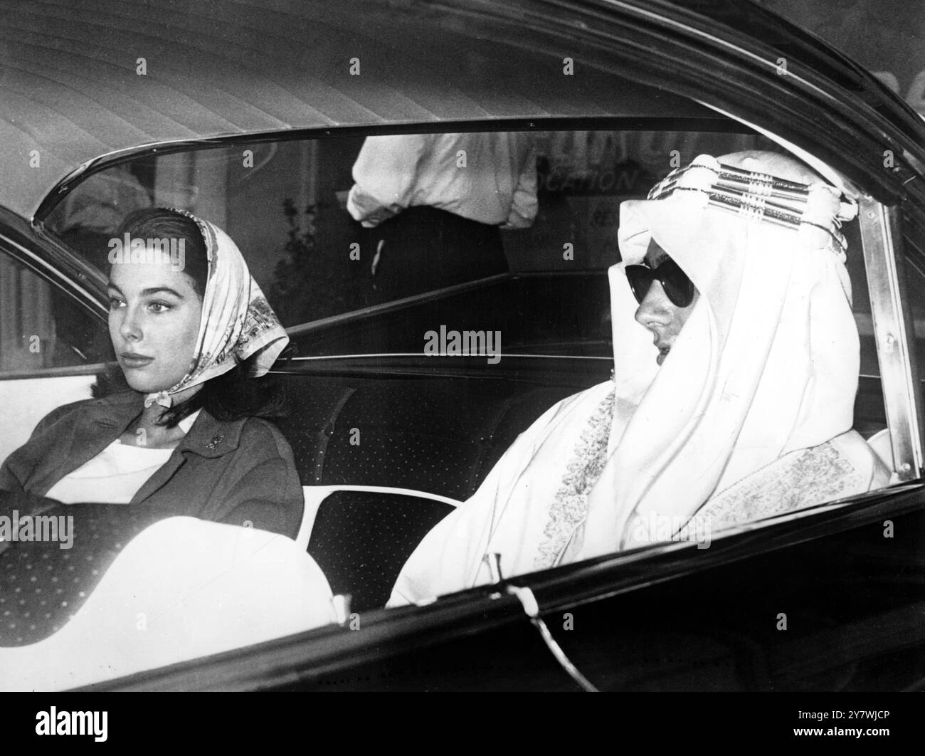 Shah Karim al-Hussayni : Born 13 December 1936 Prince Karim Aga Khan , seen here on the way from the airport in Nice , France with Miss Tracy Pelissier , step daughter of film magnate Sir Carol Reed . She was accompanied by her two London friends Miss Linda Ann Chandler and Miss Serena Mount . She denied she was engaged to Prince Karim Khan 10 August 1959 Stock Photo
