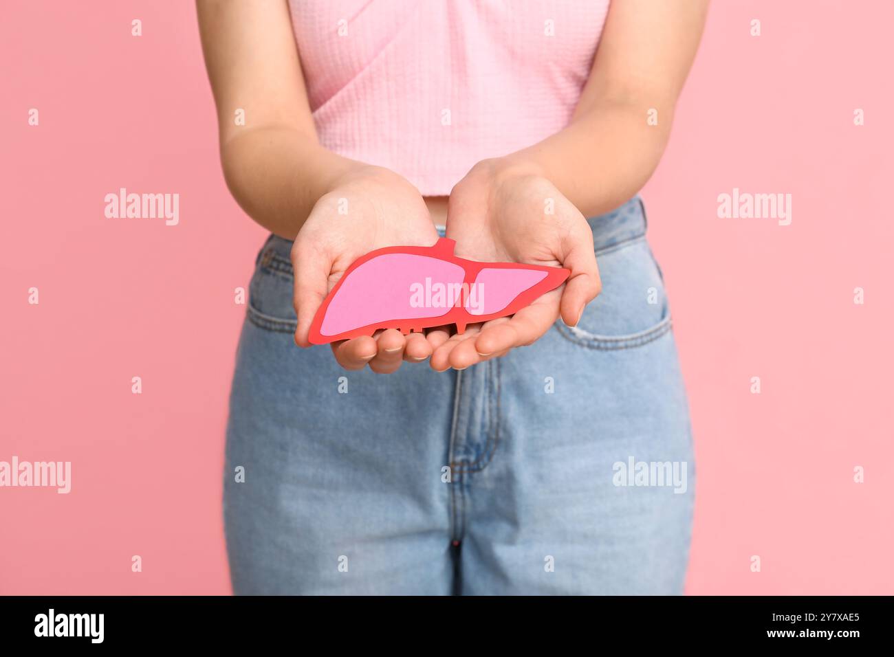 Woman holding human liver anatomy hi-res stock photography and images ...