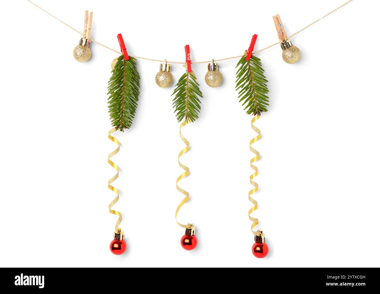 Rope with Christmas tree branches, balls and serpentine on white ...