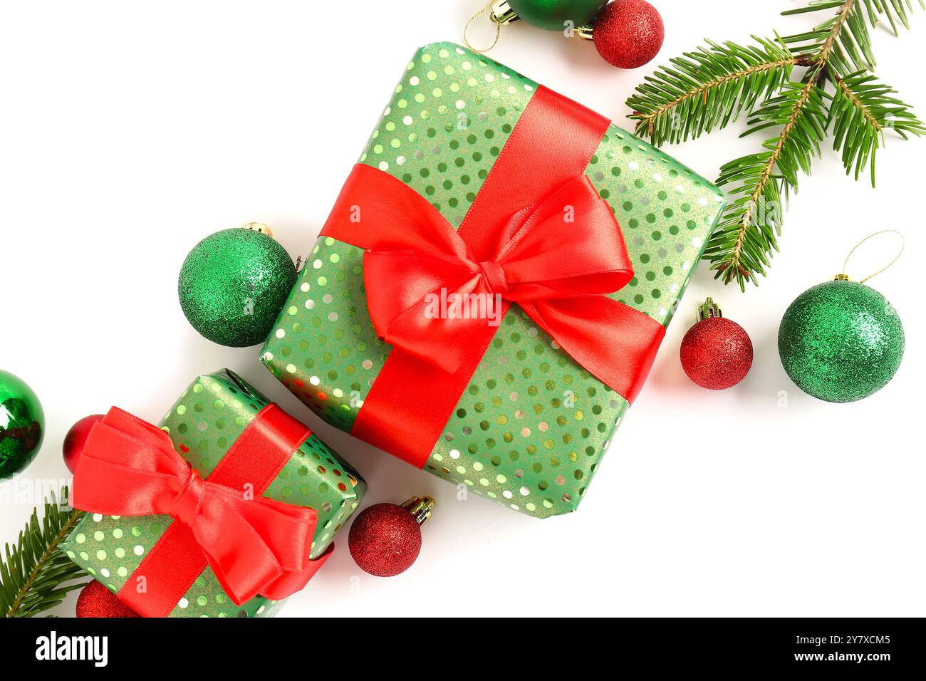 Gift boxes with Christmas tree branches and balls on white background ...