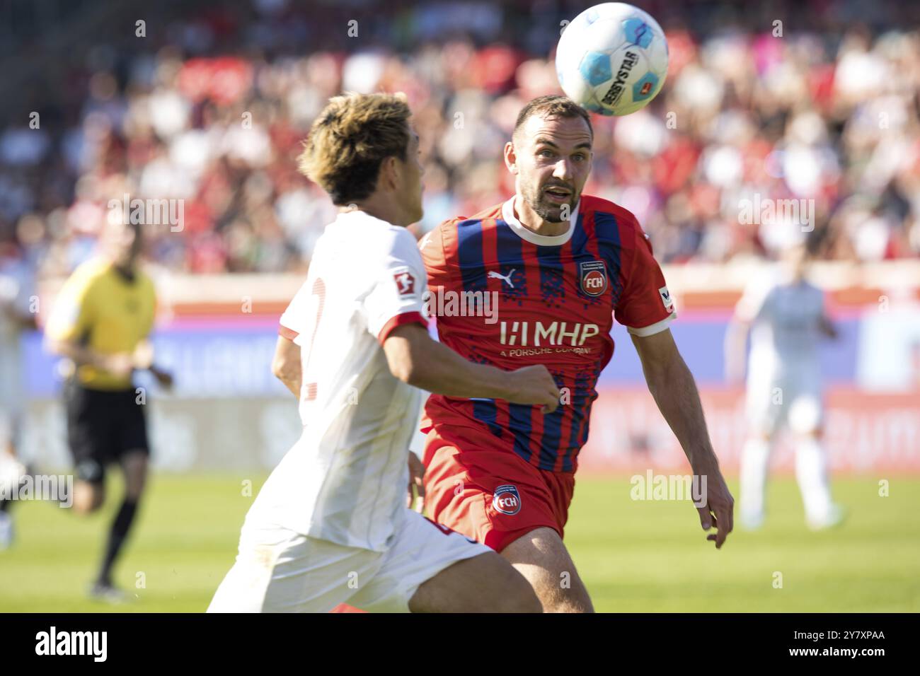 Football match, Ritsu DOAN SC Freiburg left in a duel for the ball with Benedikt GIMBER 1.FC Heidenheim and the ball in his sights, Voith-Arena footba Stock Photo