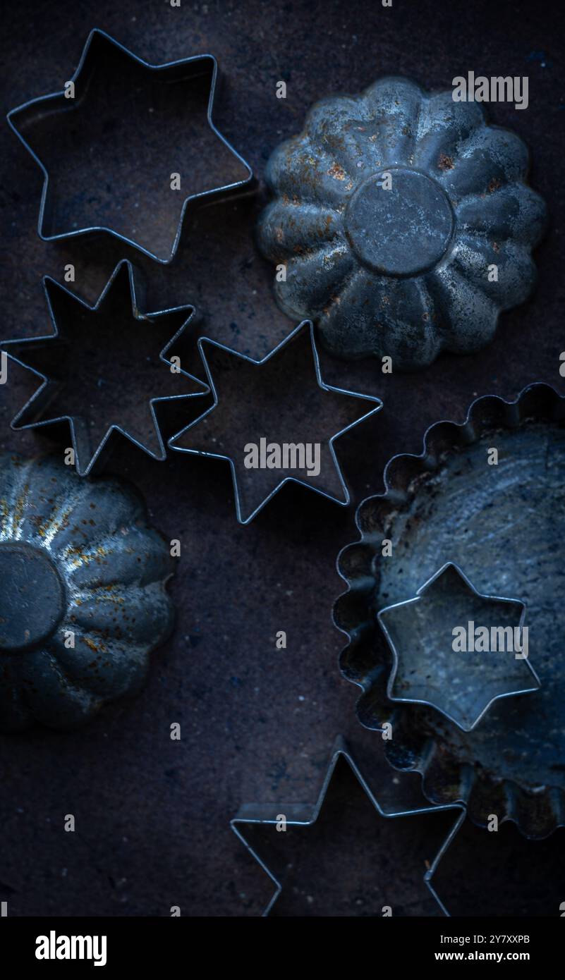 Old cookie molds on sheet Stock Photo