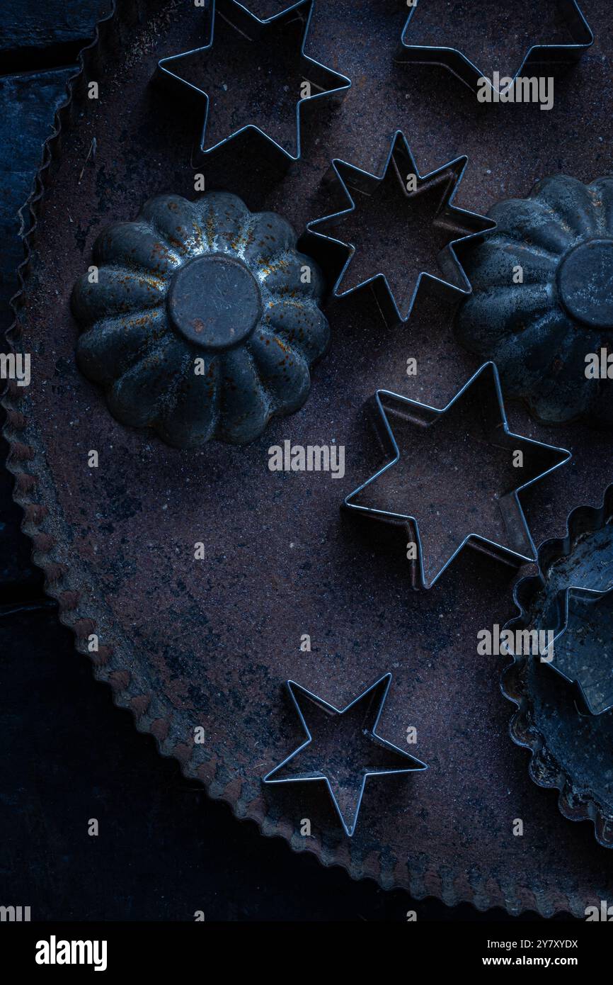 Old cookie molds on sheet Stock Photo
