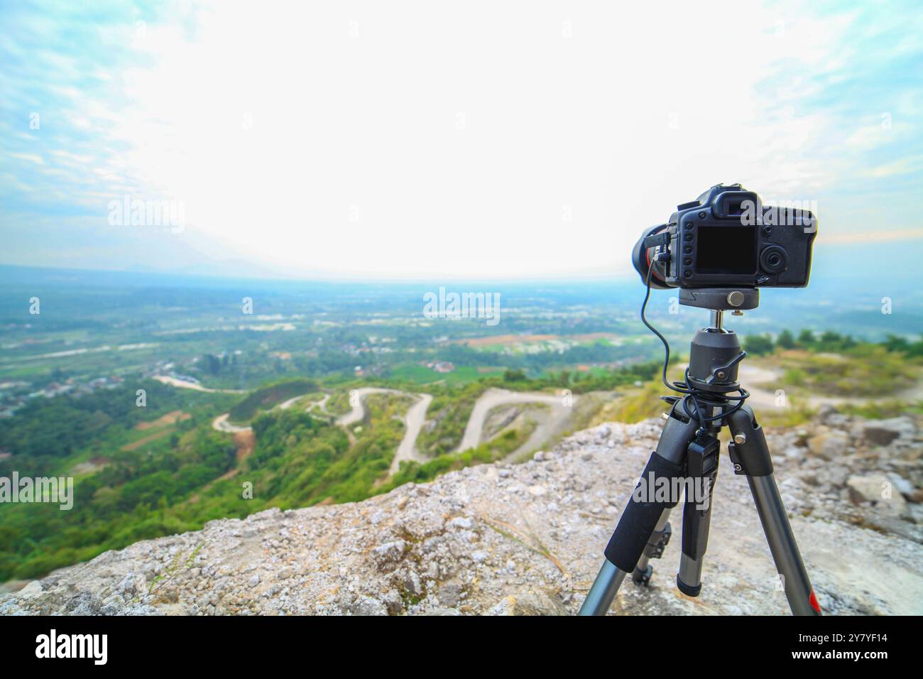 Modern professional camera on a tripod, outdoor photography in wildlife ...