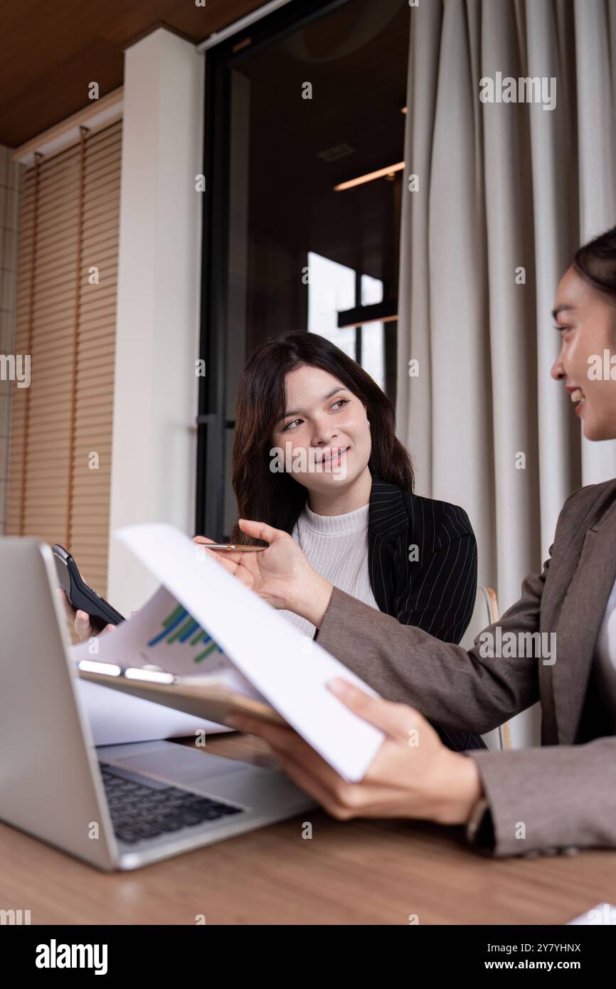 Collaborative Financial Strategy Session Between Two Professional Women Stock Photo
