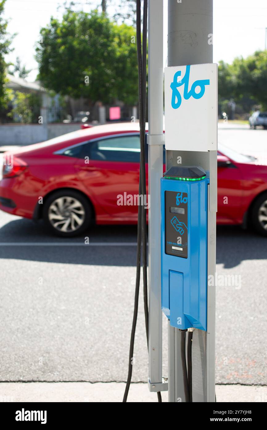 Los Angeles, California, United States - 07-03-2021: A view of a FLO electric vehicle charging station, installed on the side of a street. Stock Photo