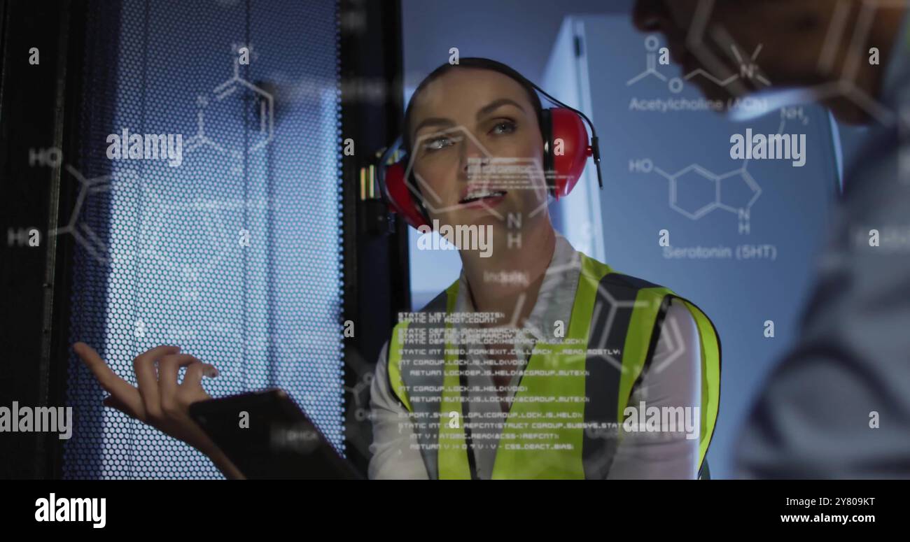 Image of data processing and chemical formula over diverse workers in server room Stock Photo