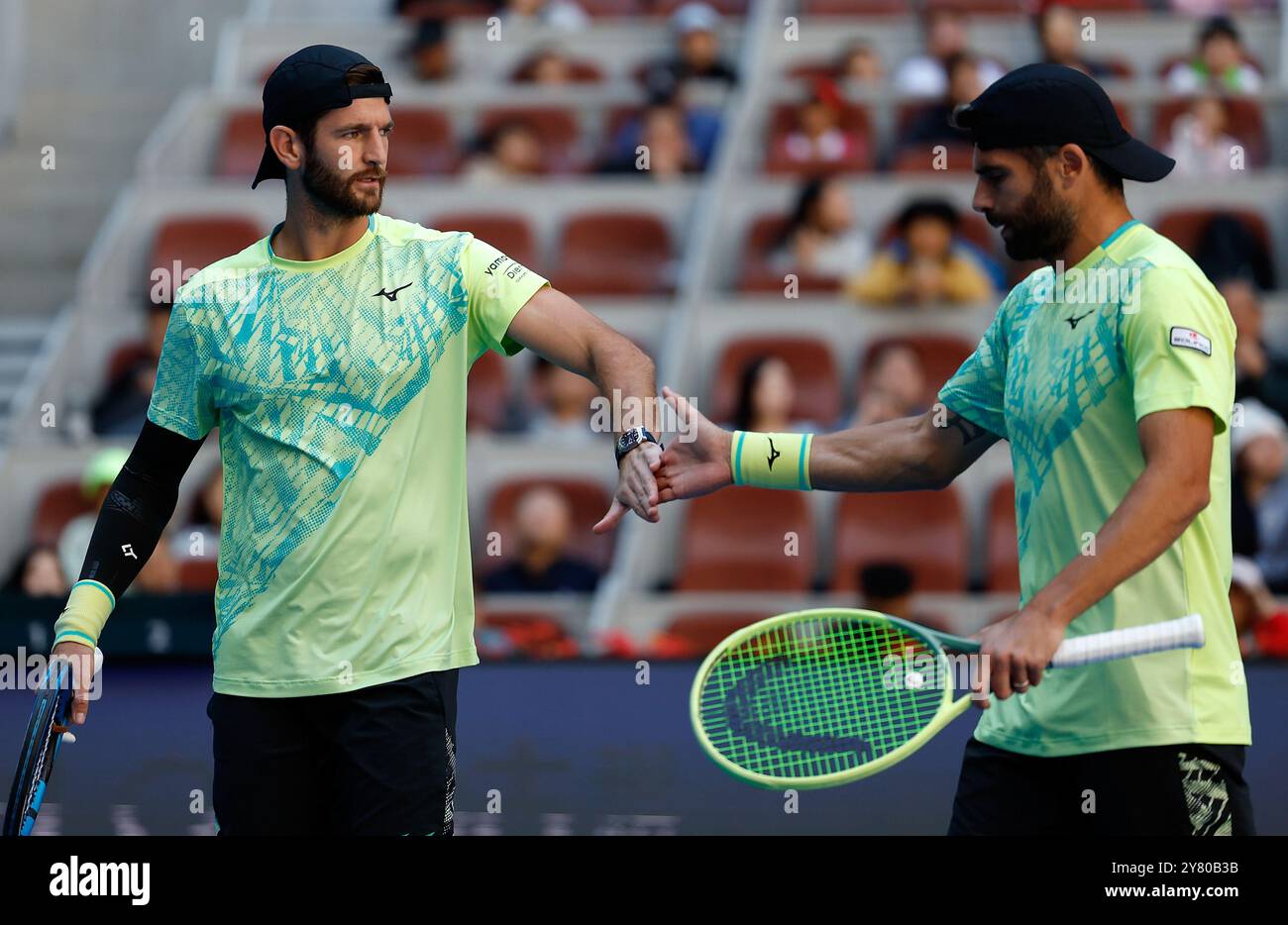 Beijing, China. 2nd Oct, 2024. Simone Bolelli (R)/Andrea Vavassori celebrate scoring during the men's doubles final between Simone Bolelli/Andrea Vavassori of Italy and Harri Heliovaara (Finland)/Henry Patten (Britain) at the 2024 China Open tennis tournament in Beijing, China, Oct. 2, 2024. Credit: Wang Lili/Xinhua/Alamy Live News Stock Photo