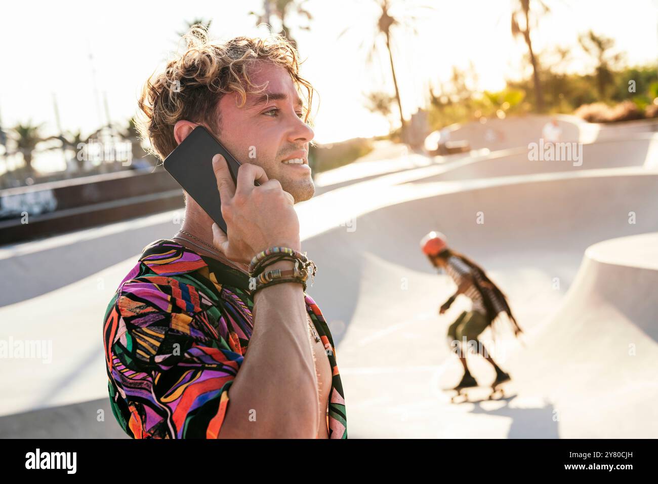 stylish millennial guy using mobile phone Stock Photo