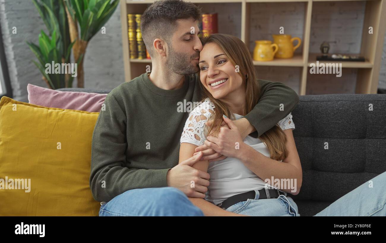 Lovingly Affectionate couple embracing lovingly in a cozy modern living room ...