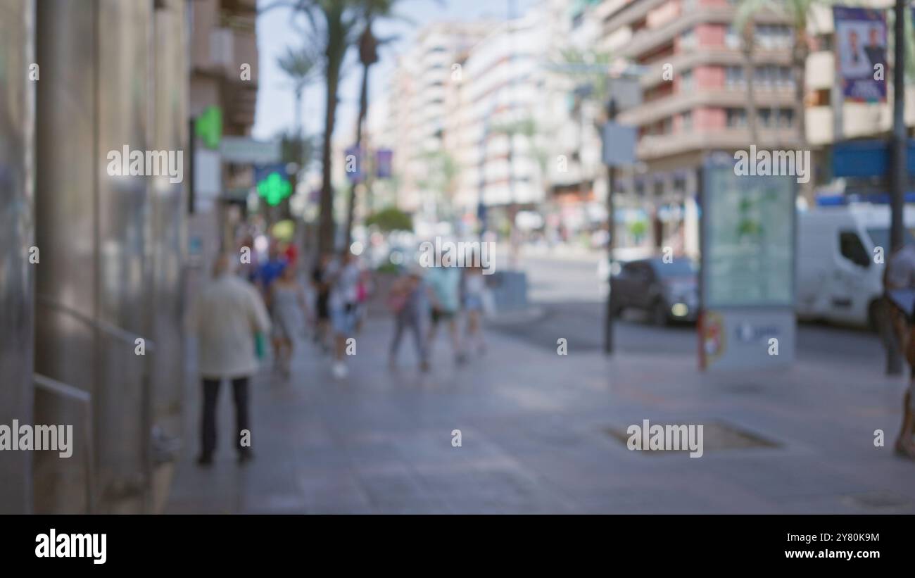 Defocused street scene with blurred pedestrians in an outdoor urban ...