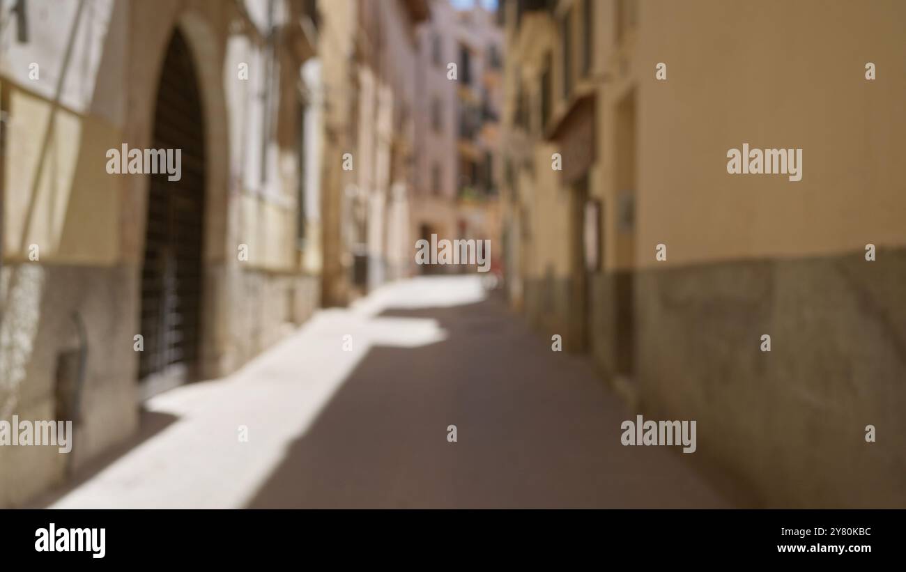Blurred narrow street in mallorca outdoor in spain with defocused ...