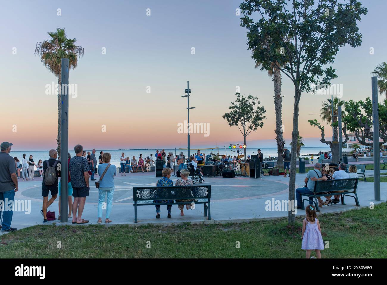 Band playing music at seafront during Music Festival in summer evening, Meze, Herault, Occitanie, France, Europe Stock Photo