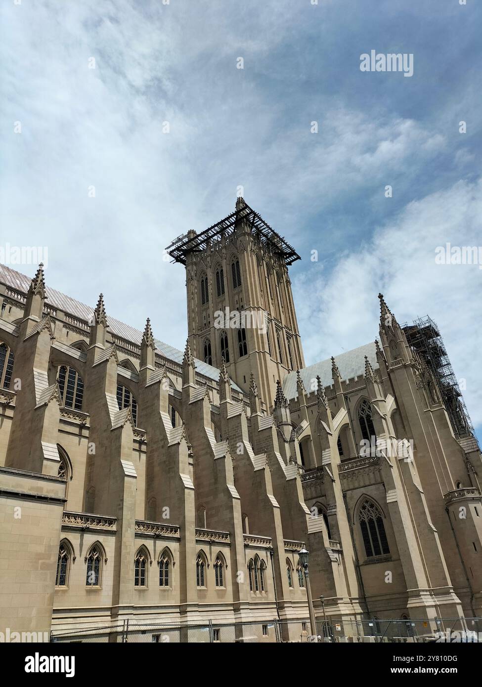 Architectural Marvel and Lush Greenery Surrounding Washington National Cathedral - Smartphone Captured Stock Image