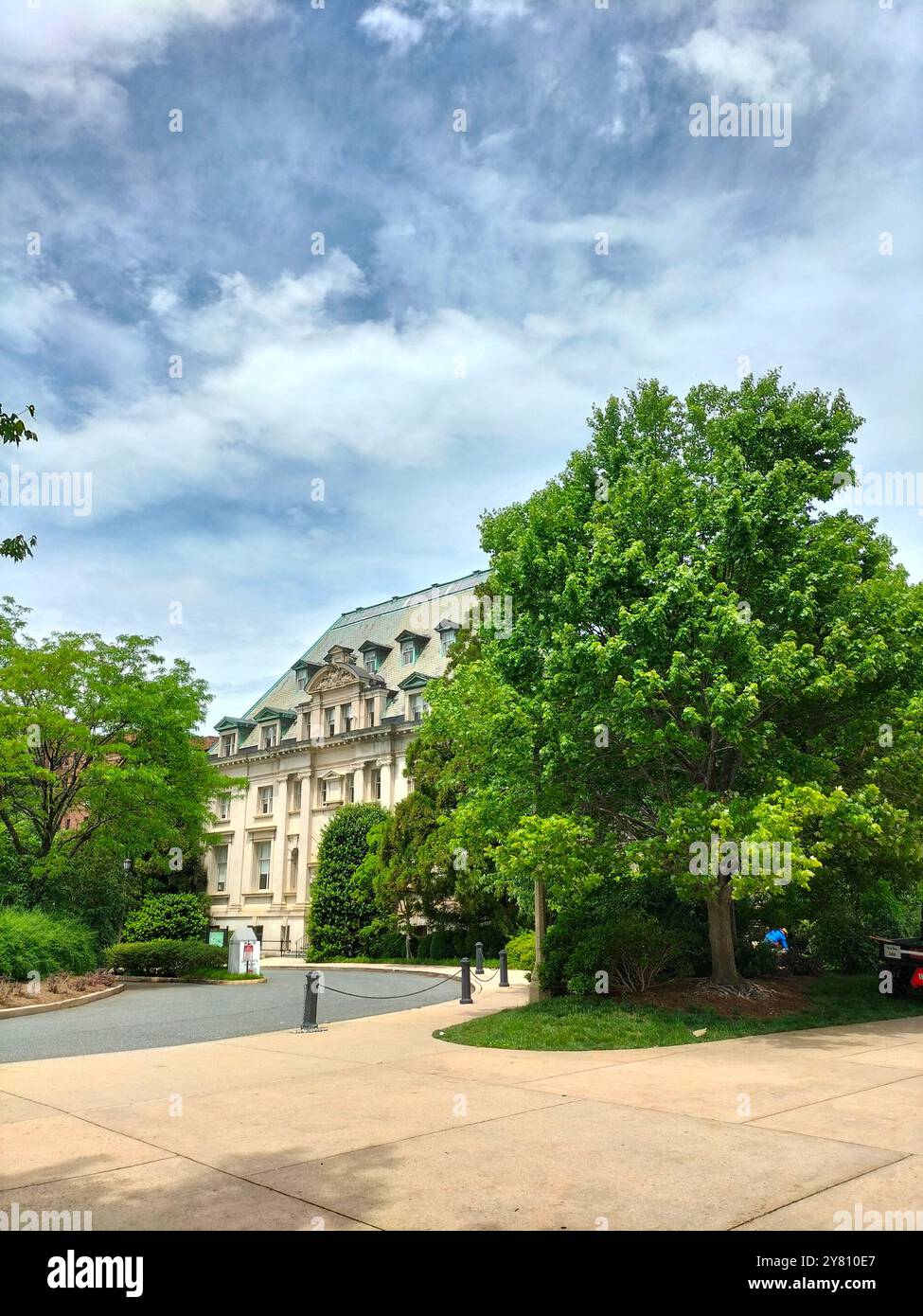 Architectural Marvel and Lush Greenery Surrounding Washington National Cathedral - Smartphone Captured Stock Image
