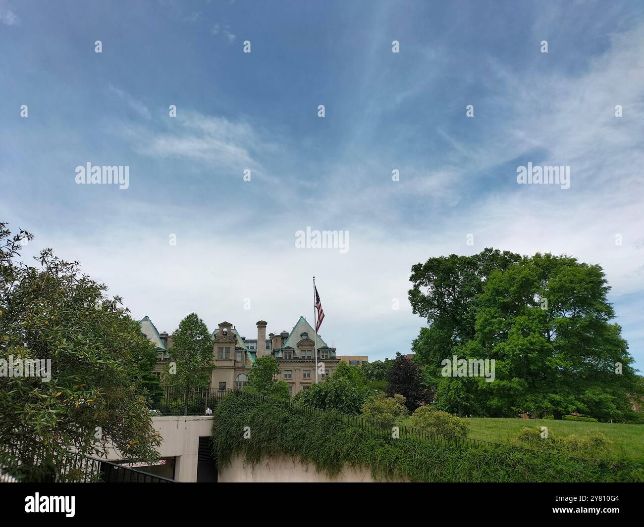 Architectural Marvel and Lush Greenery Surrounding Washington National Cathedral - Smartphone Captured Stock Image