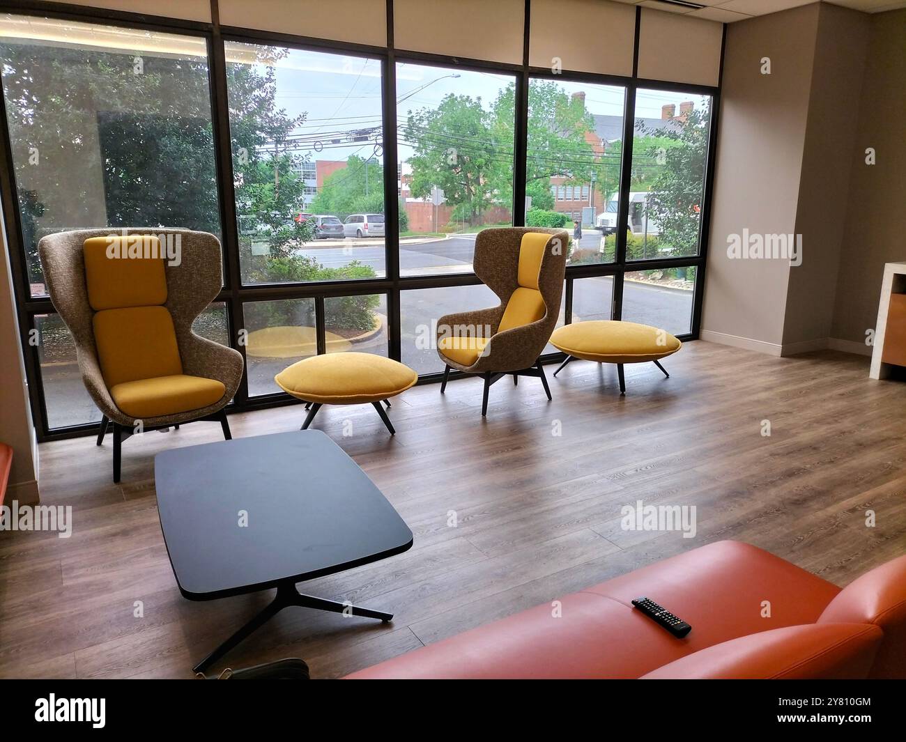 Stunning Living Room with Glass Wall Offering a Beautiful Street View - Smartphone Captured Stock Image