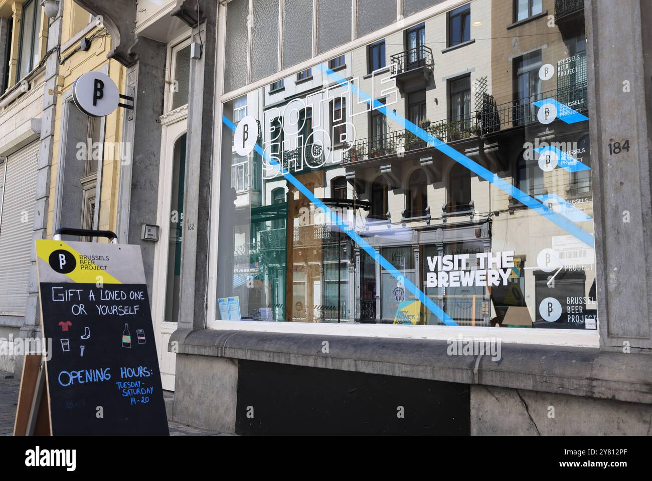 Fashionable Rue Antione Dansaert with high end boutique shops, restaurants & cafes, in Brussels, Belgium. Stock Photo