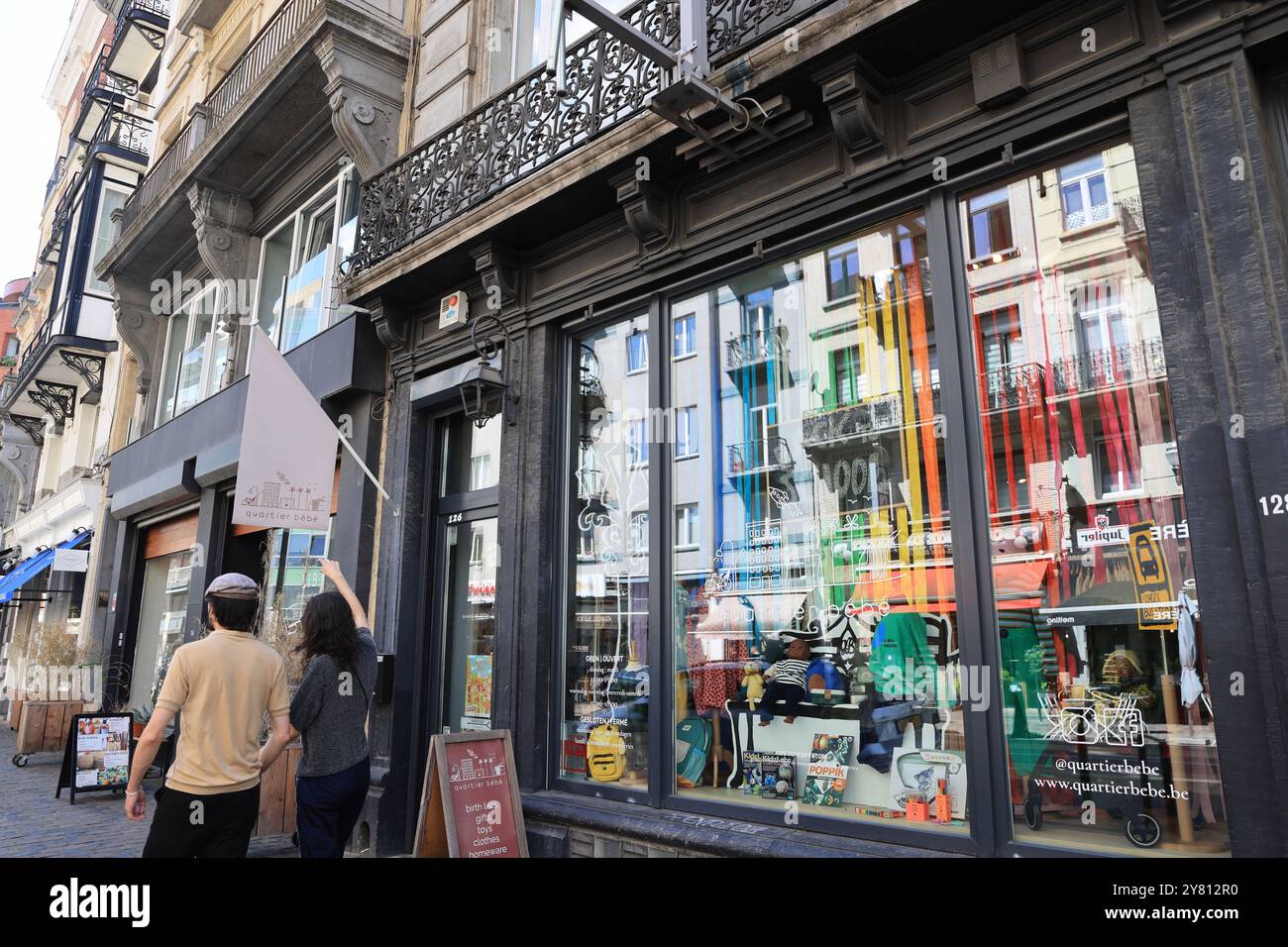 Fashionable Rue Antione Dansaert with high end boutique shops, restaurants & cafes, in Brussels, Belgium. Stock Photo