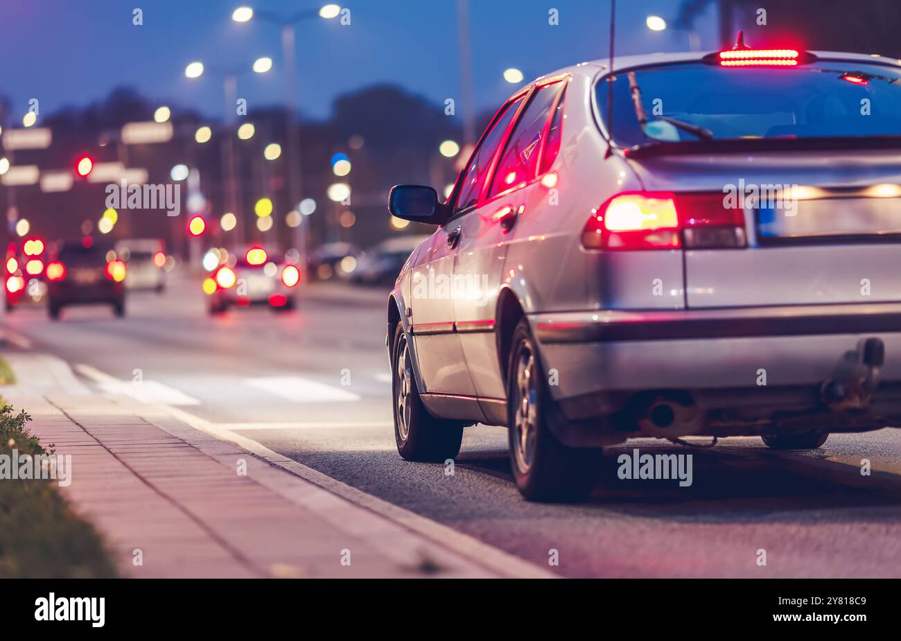 The car is standing on a pedestrian crossing waiting for the pedestrian ...