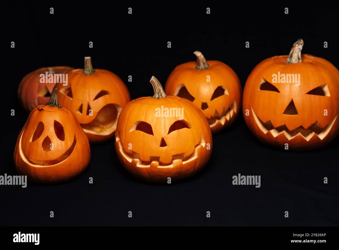orange pumpkins with carved faces for Halloween celebration. Jack's ...