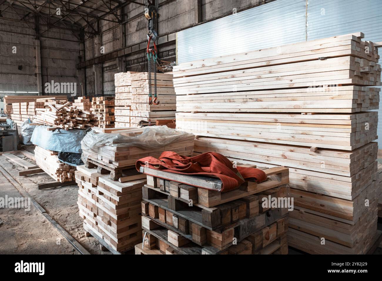 Stacked wooden planks close-up at lumber warehouse. Wood industry ...